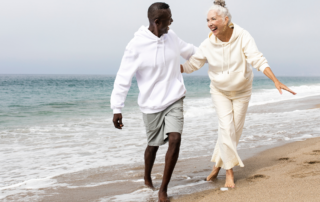 Mature couple having fun on the beach