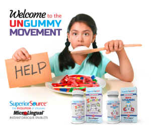 Welcome to the Ungummy movement - Girl eating a giant spoon of sugar. children's vitamins C, D and immune
